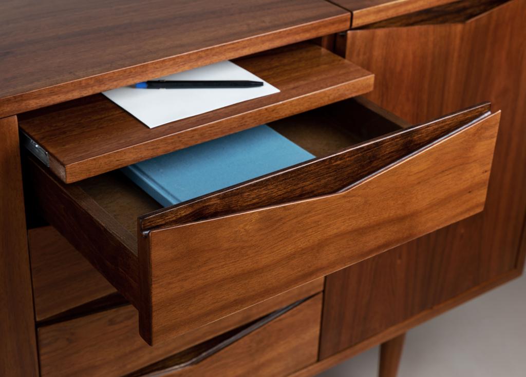Open drawers of the VIALONE sideboard showing the wooden interior.