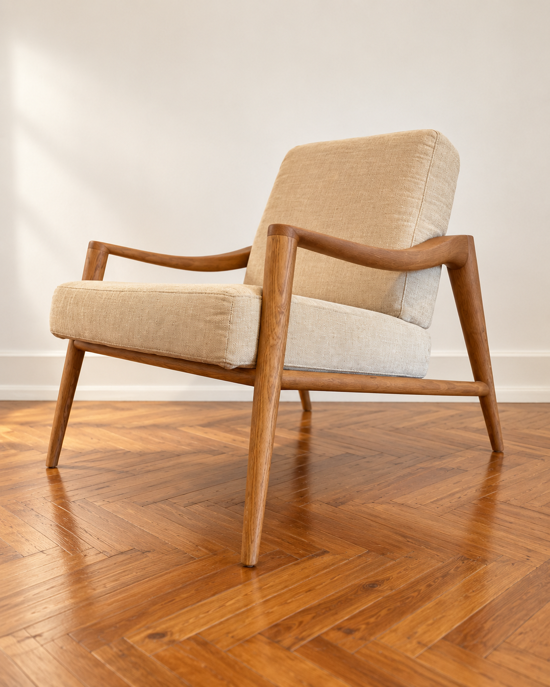 GLORIA lounge chair upholstered in beige, front three-quarter view.