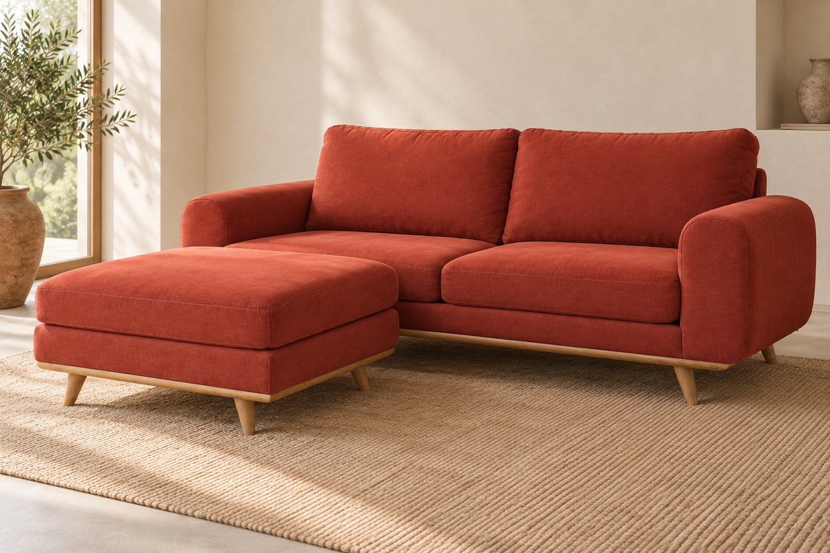 Three-quarter view of the LOTO sofa in Terracotta with an optional chaise longue and wooden base.